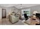 Relaxing Gathering room with pool view, office space, and light-filled interior at 1567 Waterford Dr, Venice, FL 34292