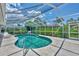 Inviting kidney-shaped pool with screened enclosure at 1567 Waterford Dr, Venice, FL 34292