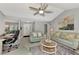 Spacious living room with light walls, comfortable seating, and view to the dining area at 1567 Waterford Dr, Venice, FL 34292