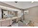 Bathroom with dual vanities and a large soaking tub at 1567 Waterford Dr, Venice, FL 34292