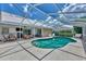 Relaxing kidney-shaped pool with screened enclosure at 1567 Waterford Dr, Venice, FL 34292