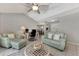 Open living room with neutral decor, comfortable seating, and a view of the dining area at 1567 Waterford Dr, Venice, FL 34292