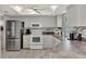 Bright kitchen featuring white cabinets and stainless steel appliances at 1567 Waterford Dr, Venice, FL 34292