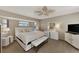 Spacious main bedroom with king-size bed and TV at 1567 Waterford Dr, Venice, FL 34292