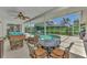 Relaxing screened-in pool area with patio furniture at 1567 Waterford Dr, Venice, FL 34292
