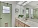 Clean bathroom with single sink vanity and shower at 1567 Waterford Dr, Venice, FL 34292