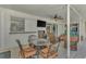 Covered patio overlooking the pool, with seating and a TV at 1567 Waterford Dr, Venice, FL 34292