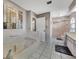 Relaxing bathroom featuring a large garden tub and separate shower at 1567 Waterford Dr, Venice, FL 34292