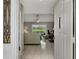 Bright entryway with tiled floors and view into living room at 1567 Waterford Dr, Venice, FL 34292