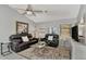 Relaxing living room featuring comfortable seating and a ceiling fan at 1567 Waterford Dr, Venice, FL 34292