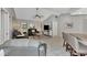 Bright and airy living room with comfortable seating and access to kitchen at 1567 Waterford Dr, Venice, FL 34292