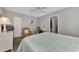 Serene bedroom with a queen-size bed and a sitting area at 1567 Waterford Dr, Venice, FL 34292