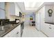 Updated kitchen featuring white cabinetry, granite countertops, and a breakfast nook at 1350 Stafford Ln # 1422, Sarasota, FL 34232
