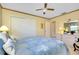 Serene bedroom with a ceiling fan and large closet at 1350 Stafford Ln # 1422, Sarasota, FL 34232