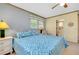 Serene bedroom with a king-size bed, ensuite bathroom access, and ample natural light at 1350 Stafford Ln # 1422, Sarasota, FL 34232