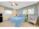 Bright bedroom with a king-size bed and sitting area at 1350 Stafford Ln # 1422, Sarasota, FL 34232