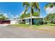 Charming single-story home with a carport and lush lawn at 1350 Stafford Ln # 1422, Sarasota, FL 34232
