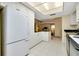 Clean and bright kitchen with ample counter space and white cabinets at 1350 Stafford Ln # 1422, Sarasota, FL 34232