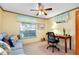 Comfortable home office space with a desk, chair, and sofa for relaxation at 1350 Stafford Ln # 1422, Sarasota, FL 34232