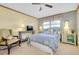 Cozy bedroom with a ceiling fan and window at 1350 Stafford Ln # 1422, Sarasota, FL 34232
