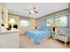 Spacious bedroom with a king-size bed and ensuite bathroom access at 1350 Stafford Ln # 1422, Sarasota, FL 34232