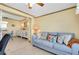 Relaxing living room with a comfortable sofa and view to dining area at 1350 Stafford Ln # 1422, Sarasota, FL 34232