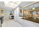Modern kitchen with white cabinets, granite countertops, and stainless steel appliances at 1350 Stafford Ln # 1422, Sarasota, FL 34232