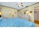 Bright bedroom with a ceiling fan and large closet at 1350 Stafford Ln # 1422, Sarasota, FL 34232