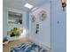 Bright entryway with double doors and beach-themed decor at 1350 Stafford Ln # 1422, Sarasota, FL 34232