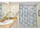Bathroom with shower and updated vanity at 1350 Stafford Ln # 1422, Sarasota, FL 34232
