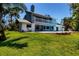 Two-story home with a spacious backyard overlooking a tranquil lake at 5885 Denison Dr, Venice, FL 34293