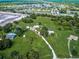 Aerial view of property showing home, outbuildings, and large lot at 1109 Twin Laurel Blvd, Nokomis, FL 34275