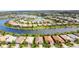 Aerial shot of a community surrounded by a lake with sidewalks and lush landscaping throughout at 13360 Esposito St, Venice, FL 34293