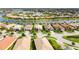 Aerial shot of homes in a community with lush landscaping along a lakeside street at 13360 Esposito St, Venice, FL 34293