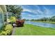 Beautiful backyard view of pond with fountain and landscaping from lanai of this home at 334 Melrose Ct, Venice, FL 34292