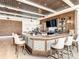 A stylish bar area featuring a modern design, ample seating, and a well-stocked display at 334 Melrose Ct, Venice, FL 34292
