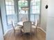 Bright dining area with white plantation shutters and a stylish light fixture creating an inviting atmosphere at 334 Melrose Ct, Venice, FL 34292