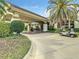 Welcoming porte cochere and manicured landscaping create a stunning first impression at 334 Melrose Ct, Venice, FL 34292