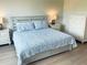 Bright main bedroom with light wood flooring, and tasteful decor at 334 Melrose Ct, Venice, FL 34292