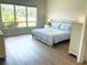 Serene main bedroom with large windows and abundant natural light at 334 Melrose Ct, Venice, FL 34292