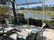 Screened-in patio overlooking a lush, well-maintained golf course and pond at 334 Melrose Ct, Venice, FL 34292