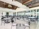 Spacious restaurant area with tile floors, ceiling fans, and large windows for beautiful views at 334 Melrose Ct, Venice, FL 34292