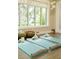 Bright yoga room with mats, blocks, and natural light, creating a serene atmosphere at 334 Melrose Ct, Venice, FL 34292