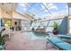 Inviting pool and patio with a built-in grill and seating area at 413 Rio Terra, Venice, FL 34285