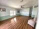 Spacious living room with light laminate flooring and ceiling fan at 257 Palm Harbor Dr, North Port, FL 34287