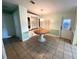 Round dining table with built-in hutch at 257 Palm Harbor Dr, North Port, FL 34287