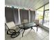 Cozy screened porch with table and chairs at 257 Palm Harbor Dr, North Port, FL 34287