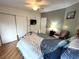Bedroom with a bed, chair, and wood-look floors at 257 Palm Harbor Dr, North Port, FL 34287