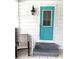 Exterior teal door with glass accents and steps at 257 Palm Harbor Dr, North Port, FL 34287