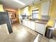 Kitchen with white cabinets and a dishwasher at 257 Palm Harbor Dr, North Port, FL 34287